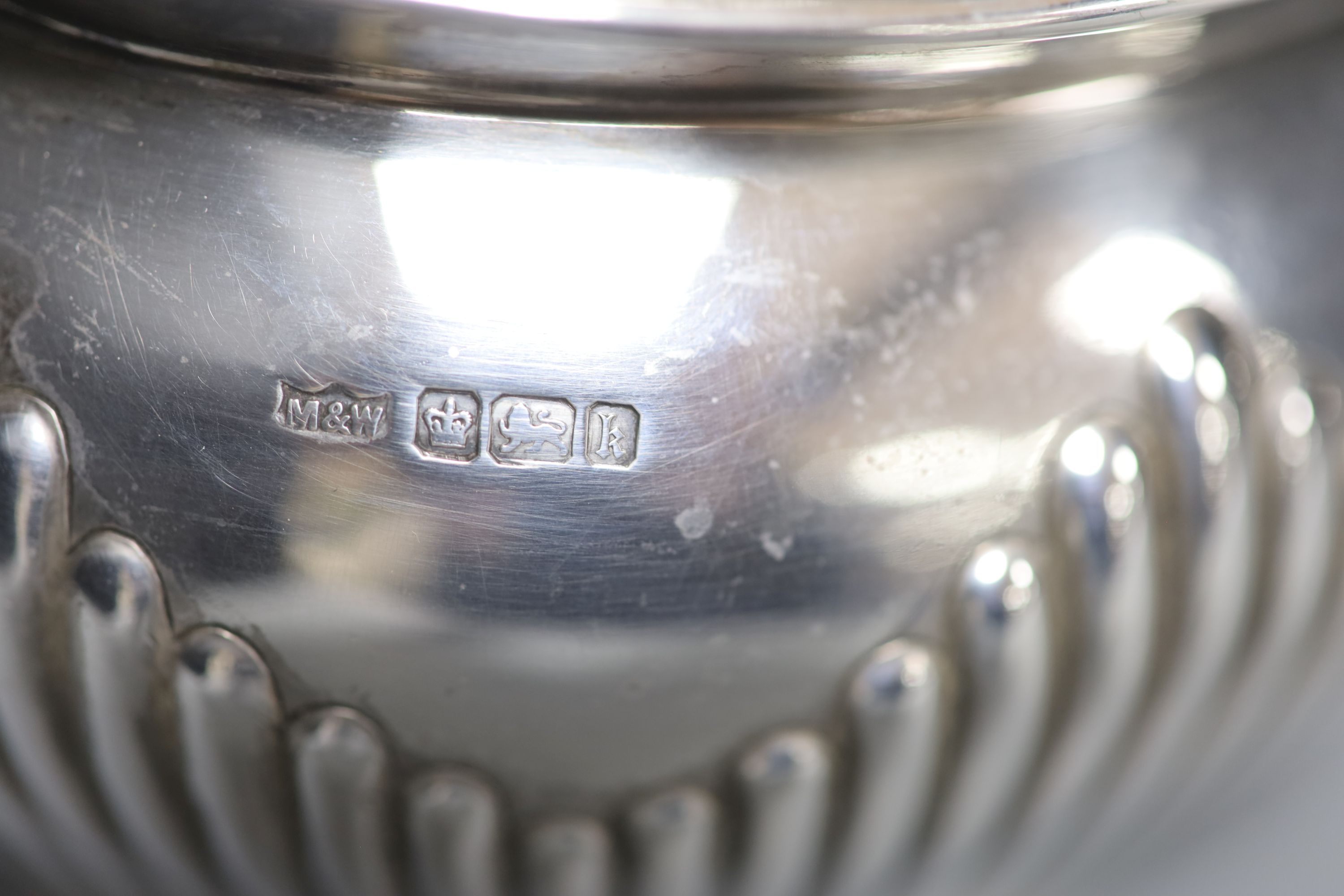 An Edwardian demi-fluted silver three piece tea set, Mappin & Webb, Sheffield, 1902